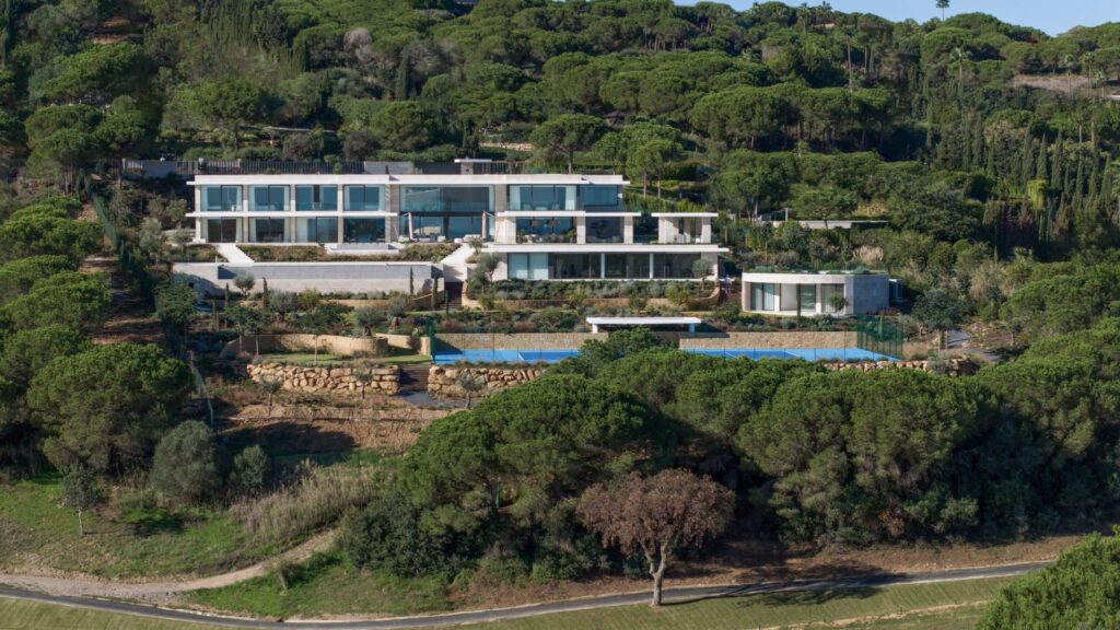 sun-drenched terrace and infinity pool area of Villa White in Sotogrande, highlighting the south-facing orientation and luxury lifestyle