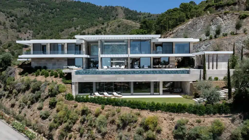 Contemporary white villa facade designed by ARK Architects in the exclusive La Zagaleta estate.