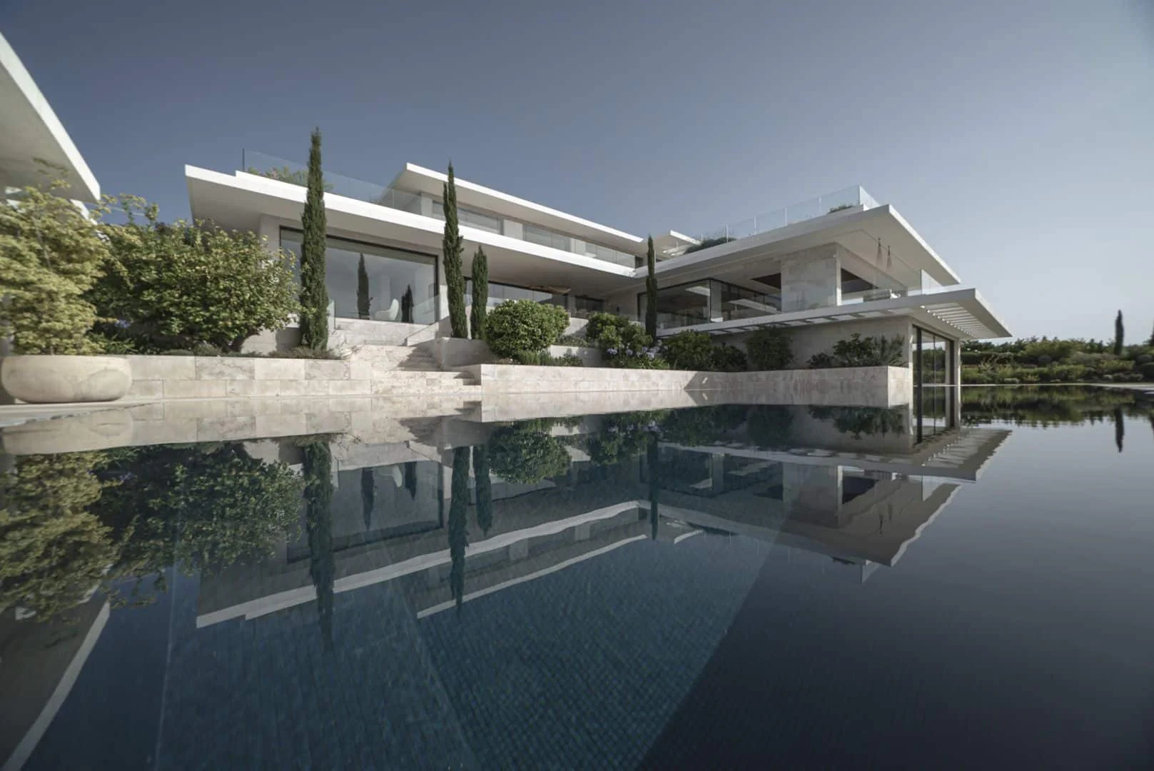 Infinity pool at sunset in Villa Tucana, a bespoke residence designed by ARK Architects.