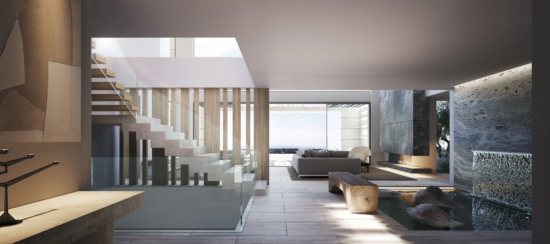 Modern open-plan living room with natural stone flooring and floor-to-ceiling glass walls designed by Manuel Ruiz Moriche in La Reserva.