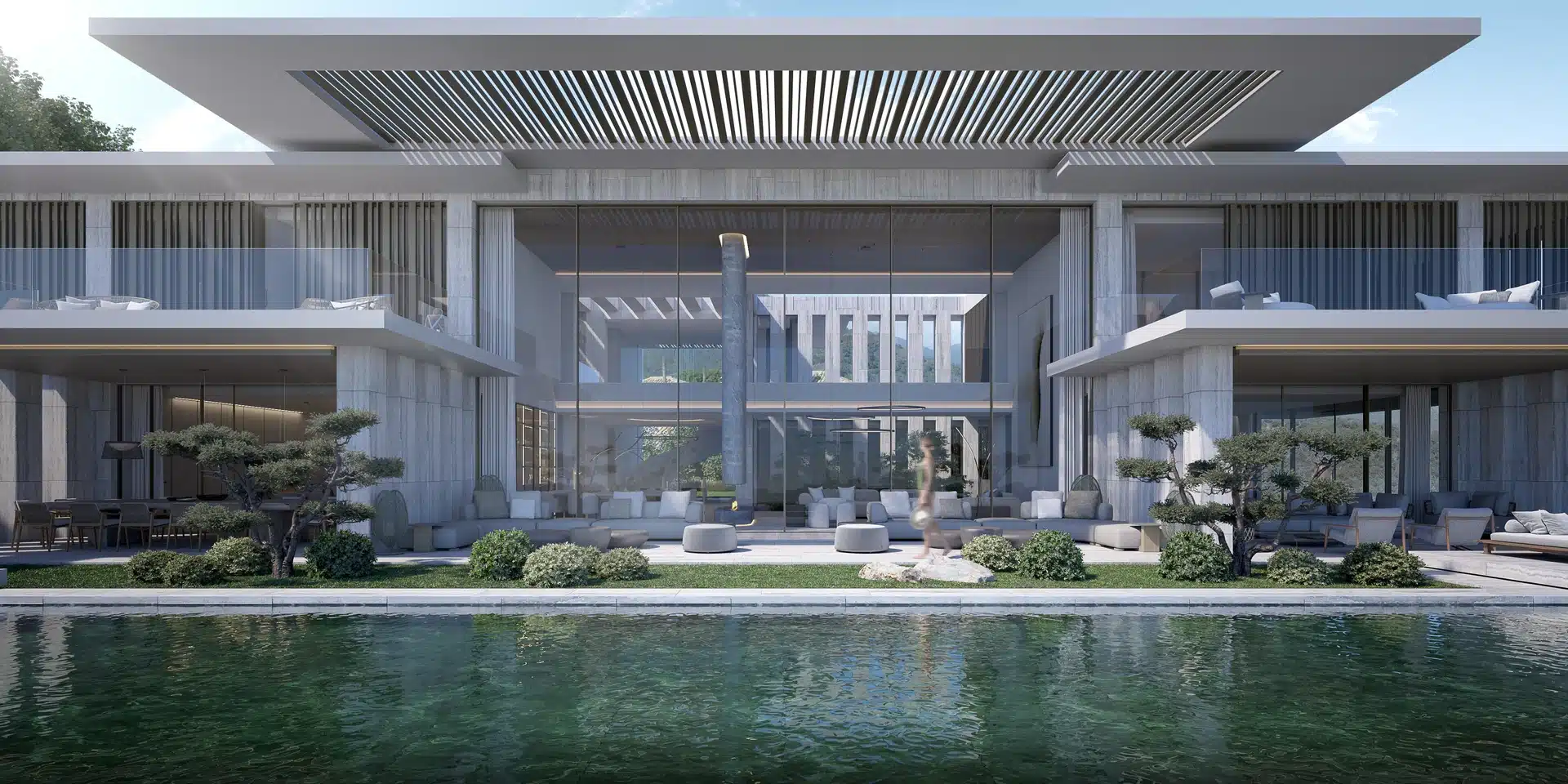 Contemporary residence designed by ARK Architects featuring a grand entrance with natural stone and water features.