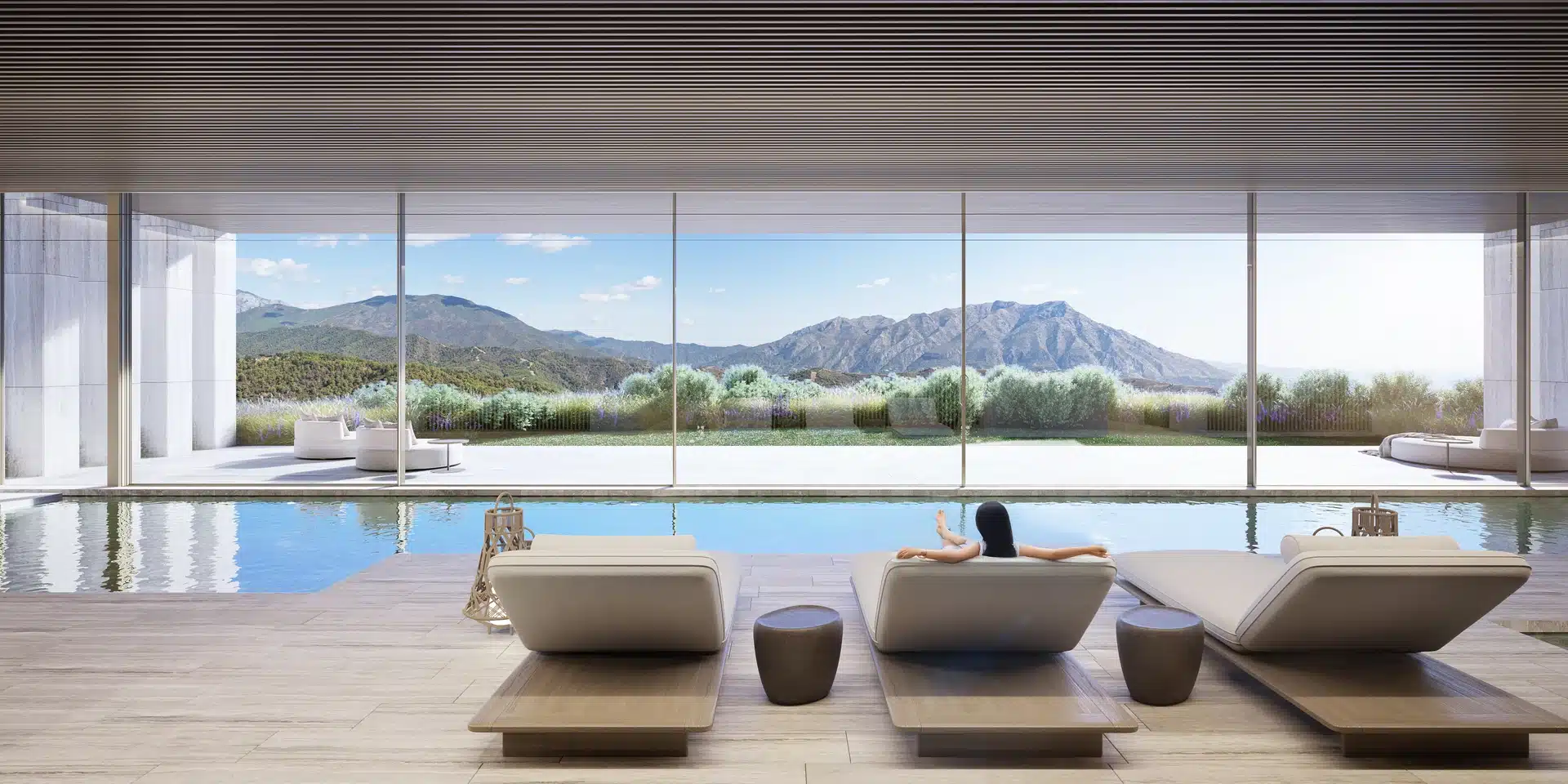 Luxury infinity pool with a spacious chill-out area showcasing the signature style of Manuel Ruiz Moriche.