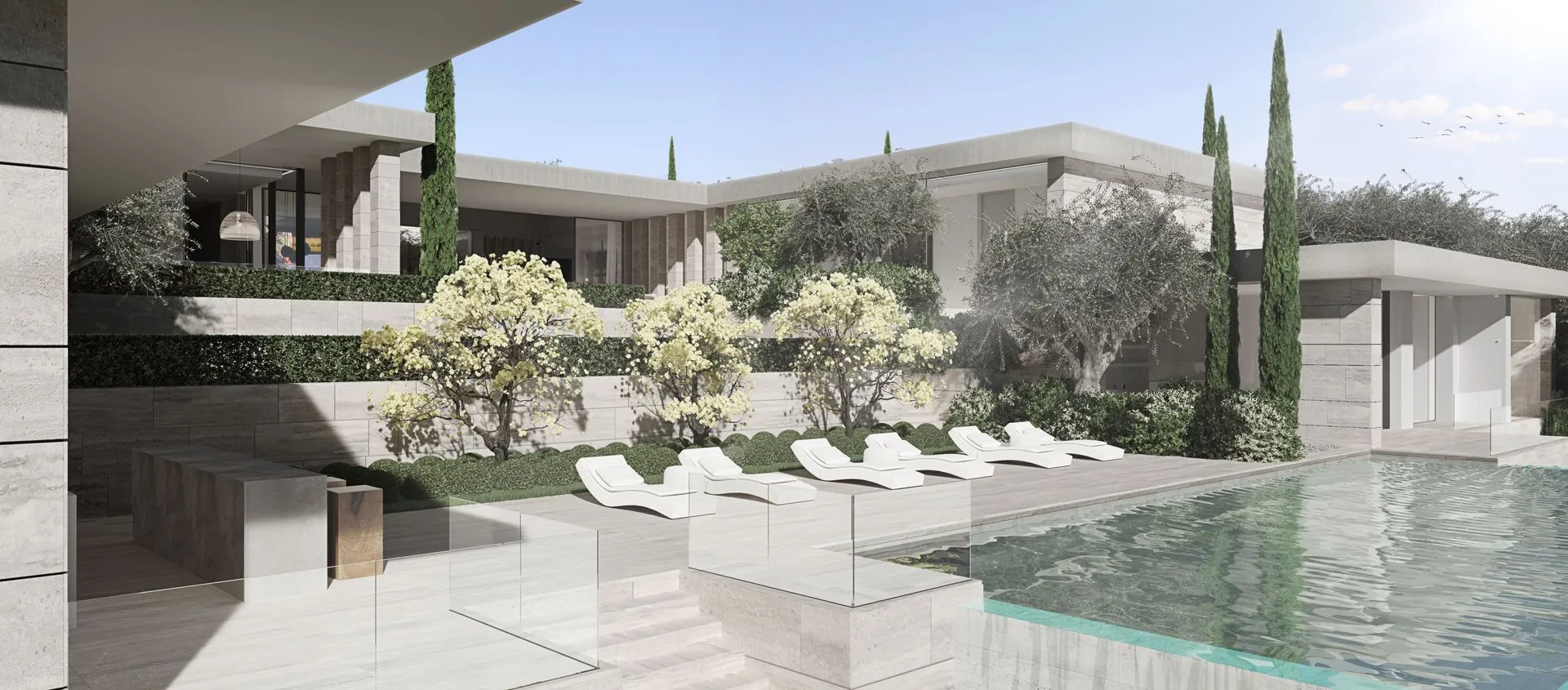 Architectural masterpiece by ARK Architects in Sotogrande, featuring minimalist lines, natural stone cladding, and warm integrated lighting at sunset.