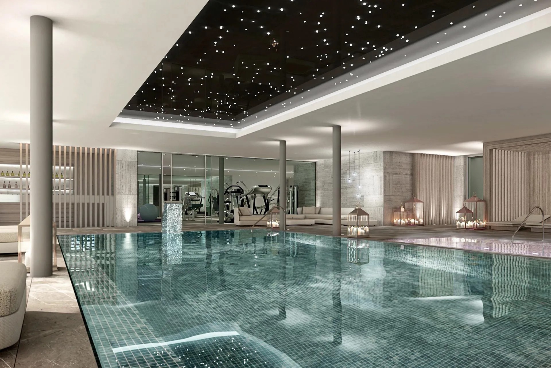 Minimalist indoor heated pool with natural stone finishes and atmospheric lighting.