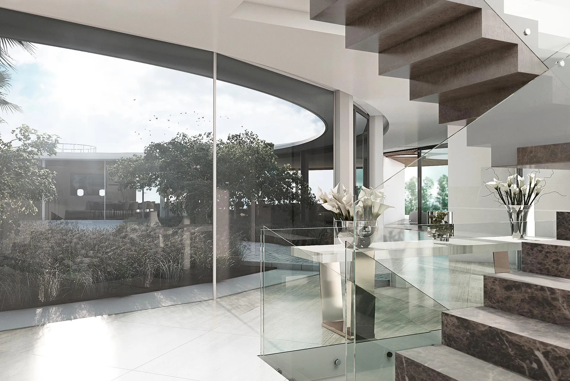 Modern sculptural staircase and indoor-outdoor flow designed by Manuel Ruiz Moriche.