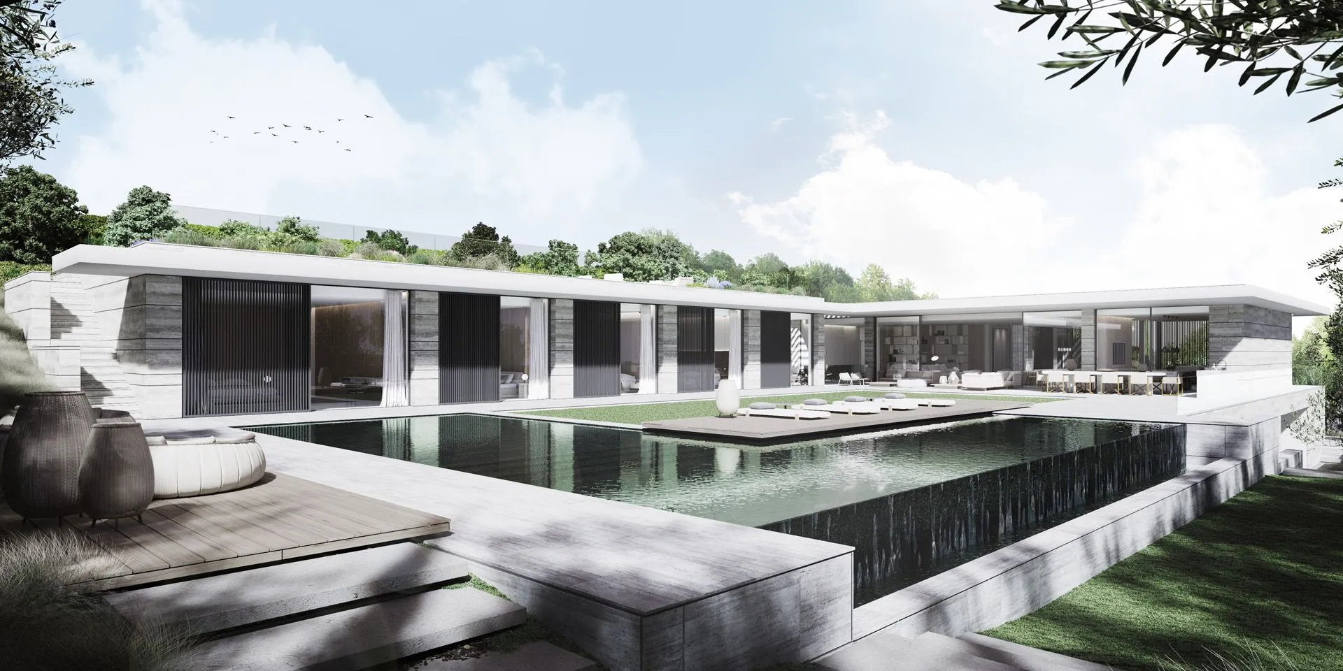 L-shaped luxury villa with a large infinity pool, travertine stone terraces, and minimalist outdoor lounge areas.