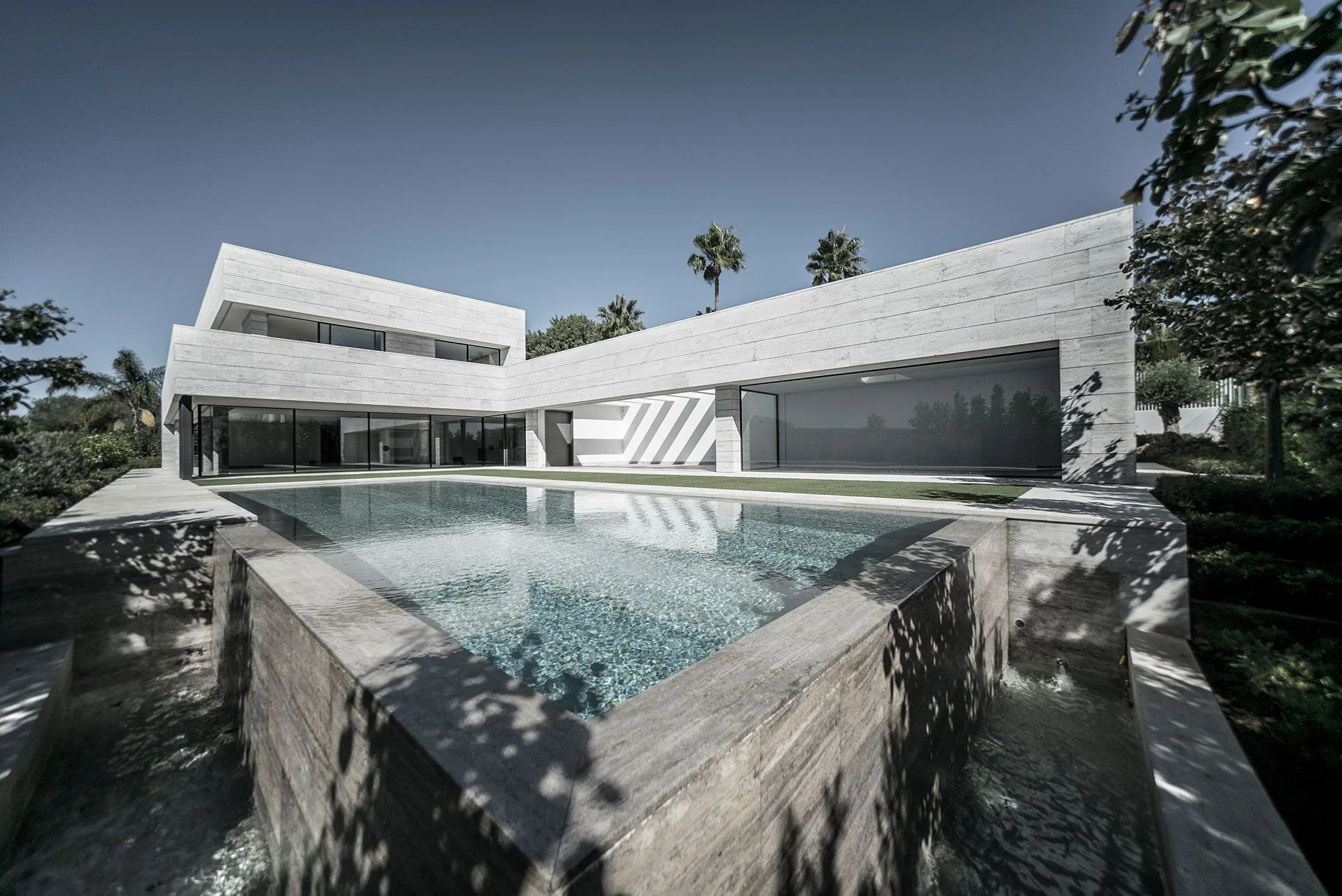 Logika luxury villa pool and terrace at dusk, private sanctuary in Sotogrande