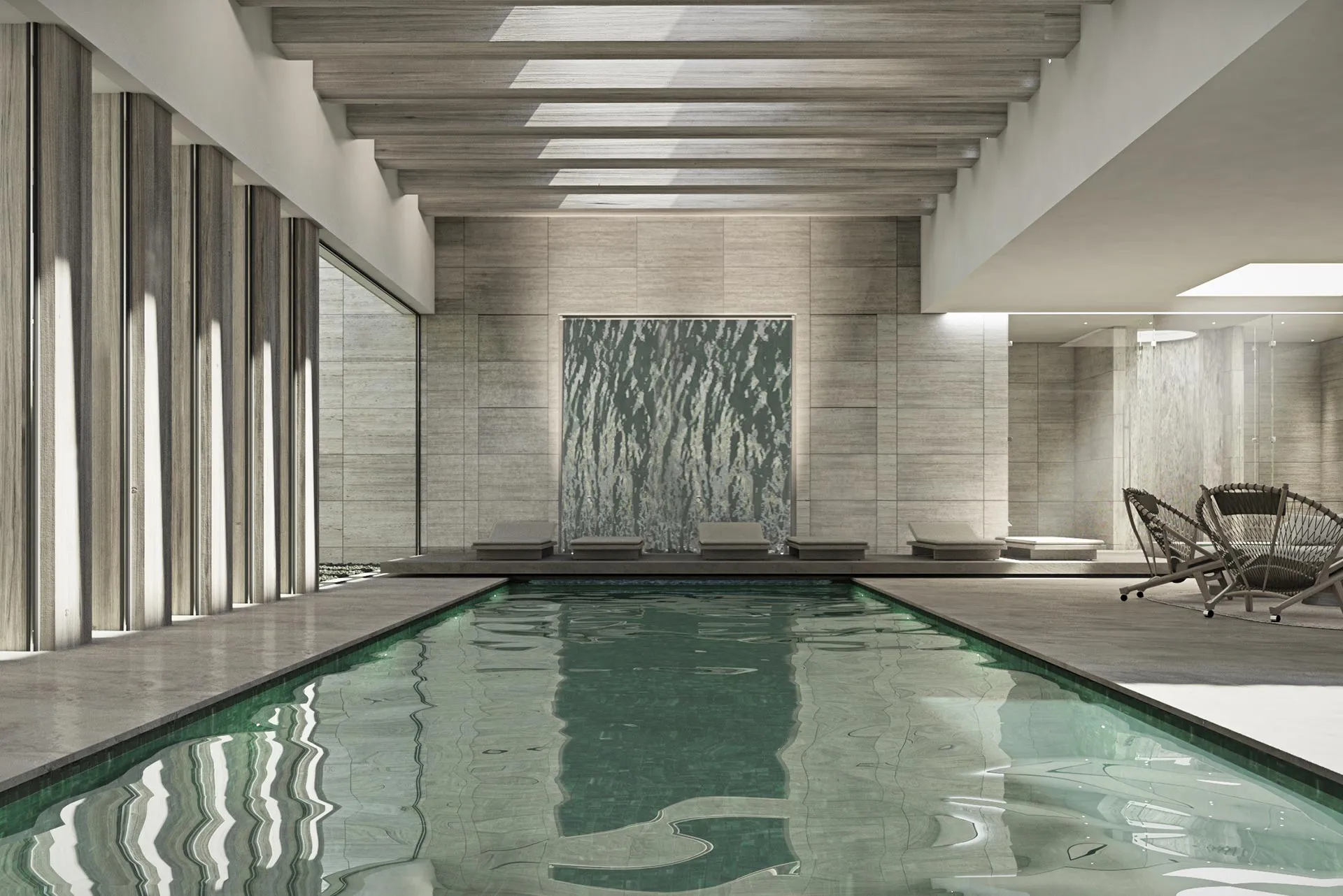 Exclusive indoor heated pool with architectural concrete beams, natural overhead lighting, and a textured stone feature wall.