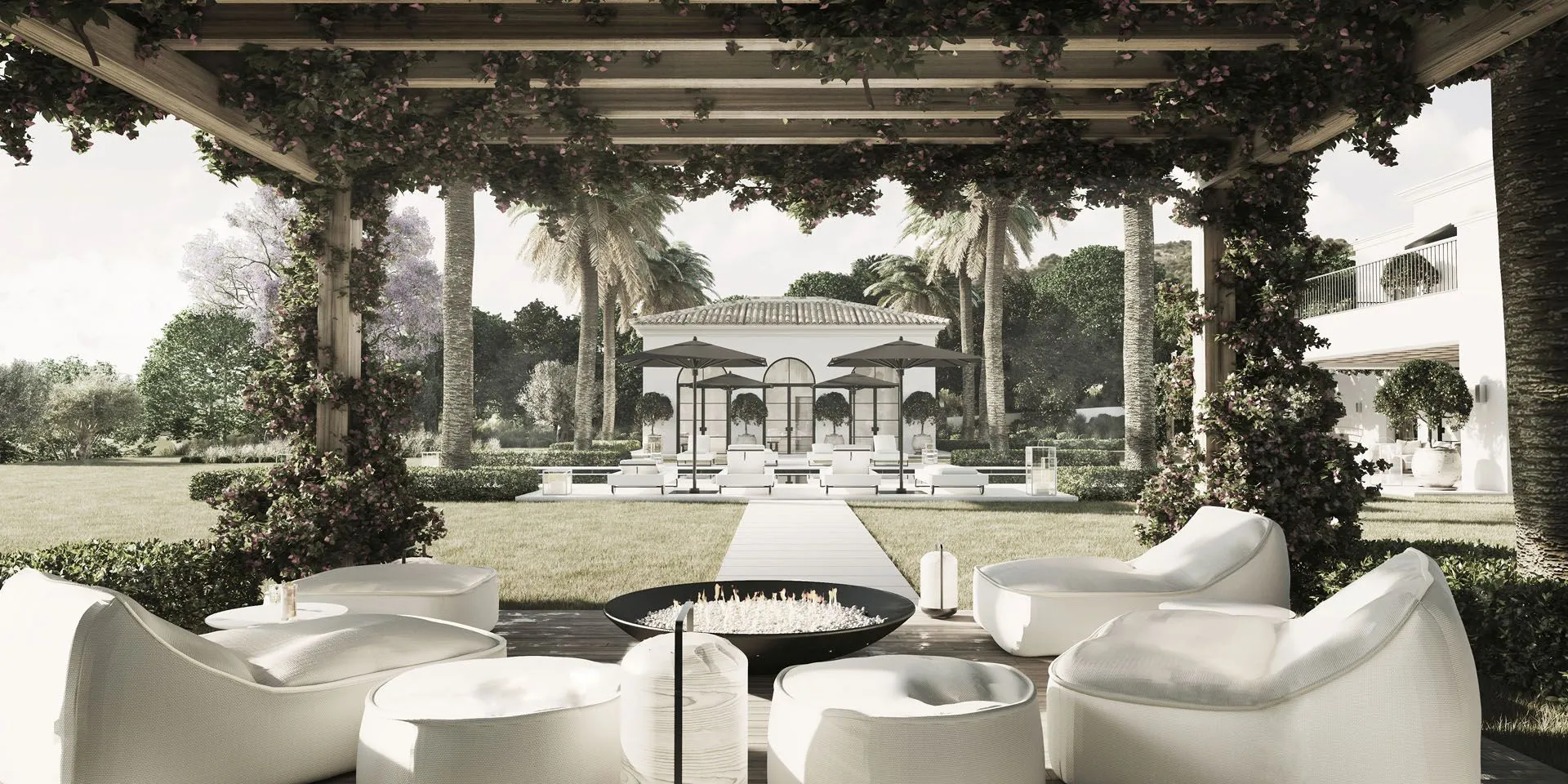Sophisticated covered terrace with natural stone flooring and minimalist outdoor furniture overlooking the garden.