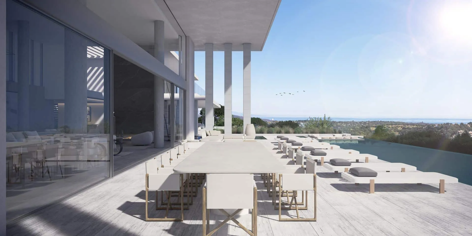 Elegant shaded outdoor dining area on a travertine terrace overlooking the Mediterranean landscape.