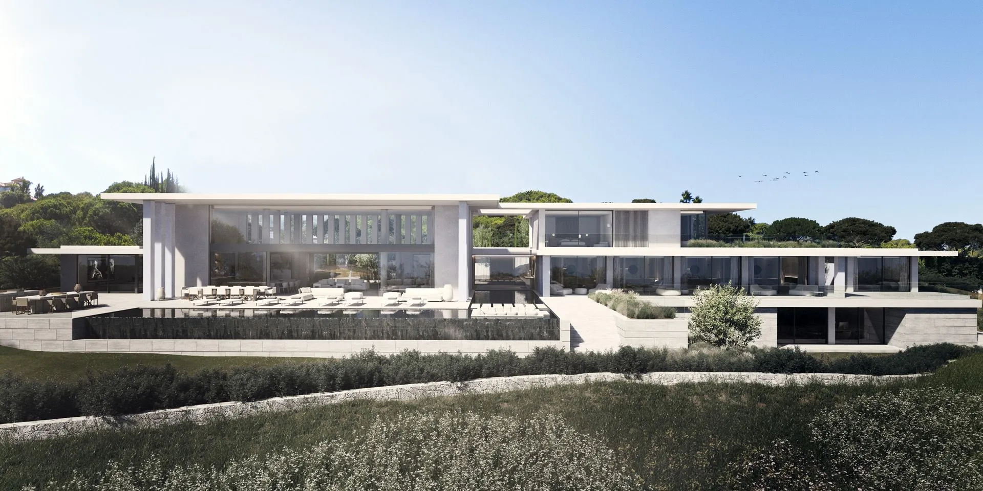 Stunning contemporary white villa architecture with expansive glass facades and manicured landscape integration.