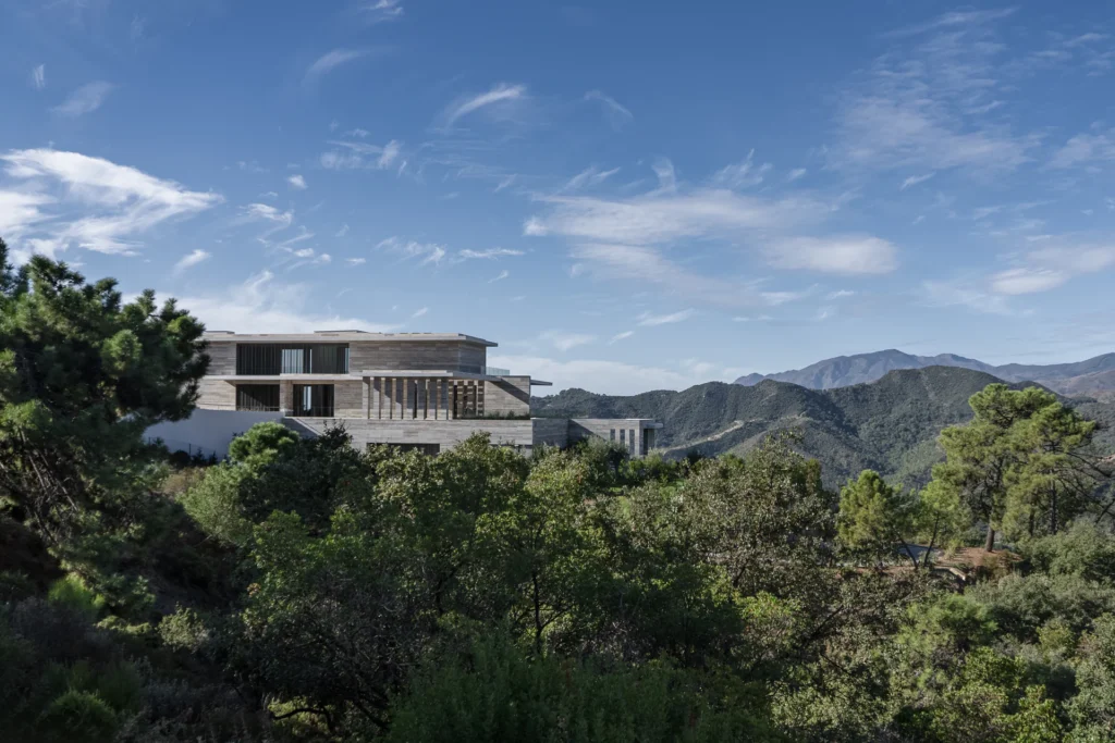 View of the organic architecture of a modern residence from the garden level in La Zagaleta.