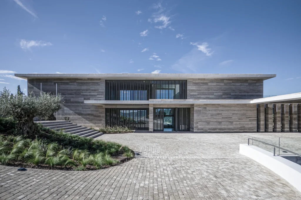 General exterior view of a luxury home showing the seamless integration of the building within the La Zagaleta plot.