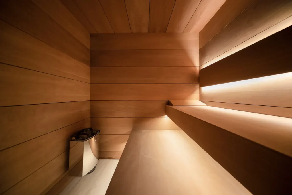 Bespoke relaxation area designed by Manuel Ruiz Moriche focusing on light, natural wood, and well-being.