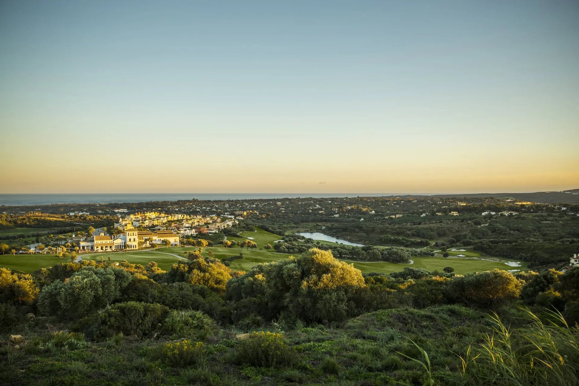 panoramic sunset view of La Reserva golf course and Sotogrande landscape towards the sea